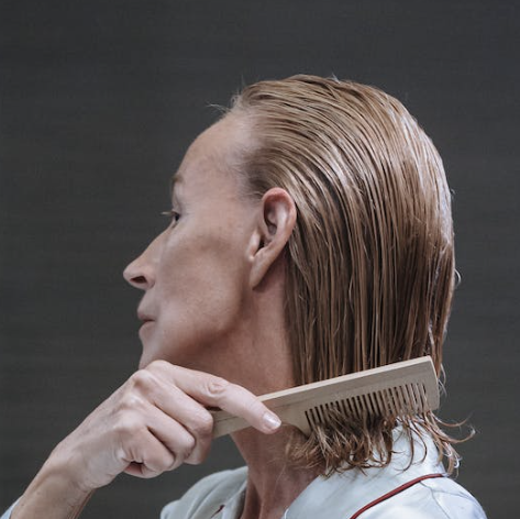 woman combing hair